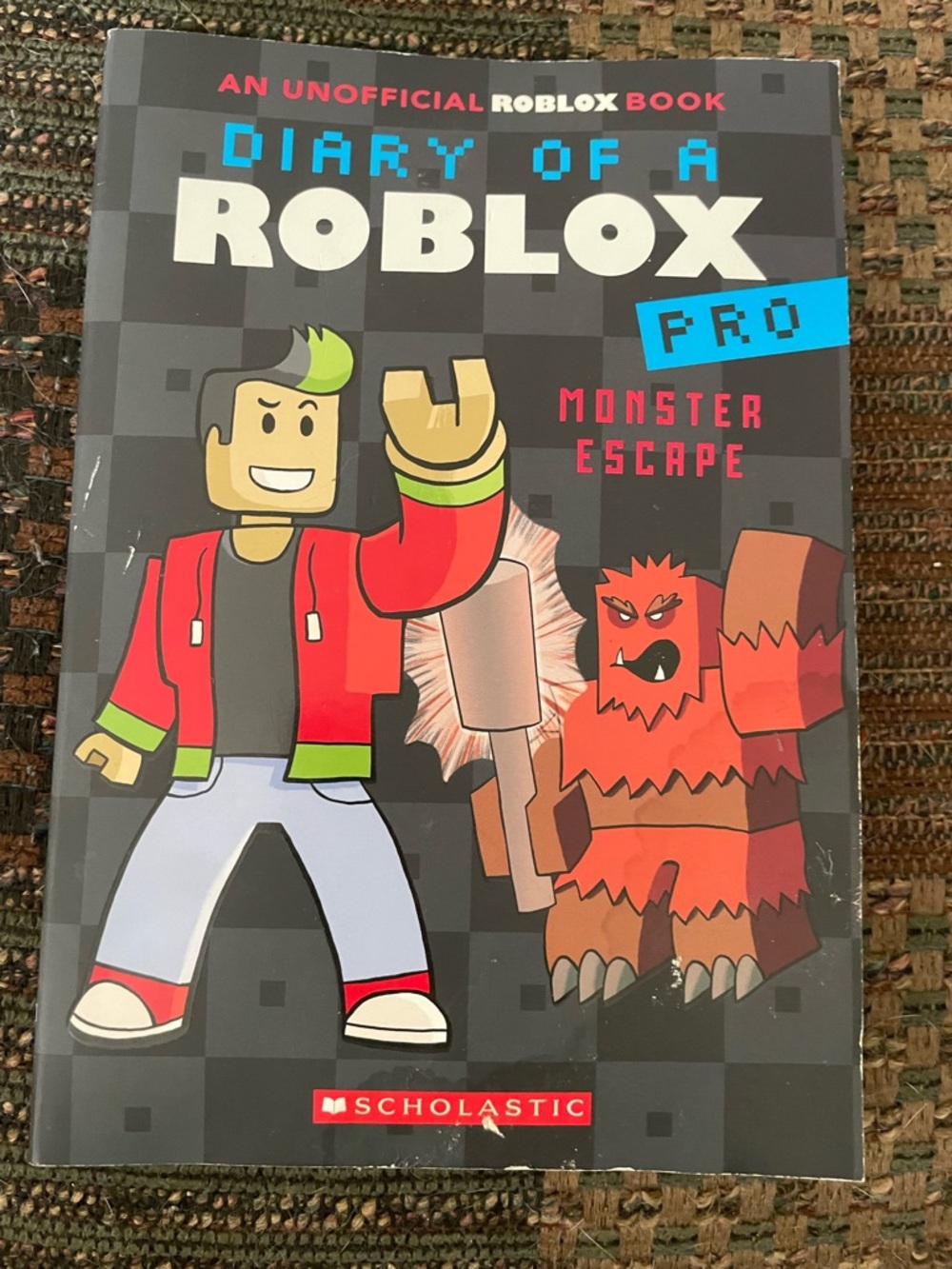 Scholastic Roblox Back-Cover Book — Black, Yellow, Pink, Blue